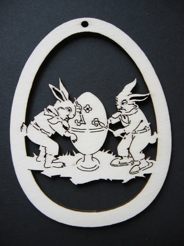 Rabbits Painting Egg Wood Ornament by Wandera GmbH